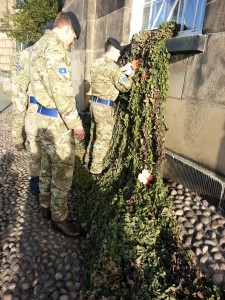 Members of the Queen’s Dragoon Guards adding the first poppies 